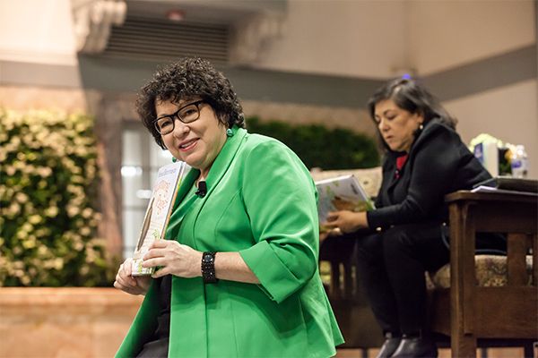 Supreme Court Justice Sonia Sotomayor holding her book Turning Pages