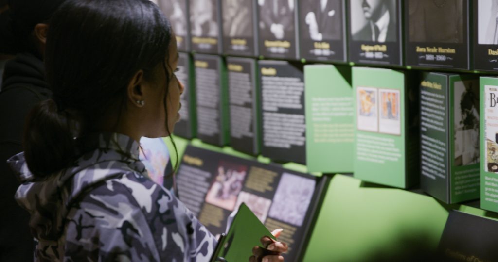 Visitor interacting with the Nation of Writers display at the American Writers Museum