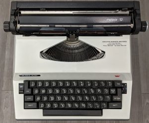 Top-down image of Maya Angelou's Meteor 12 typewriter on display at the American Writers Museum