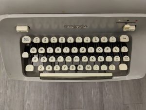 Top-down image of Hugh Hefner's Royal typewriter on display at the American Writers Museum