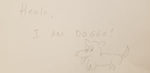 A drawing of a dog and text that say "Henlo, I am doggo." Drawn by a visitor at the Story of the Day exhibit at the American Writers Museum in Chicago, Illinois