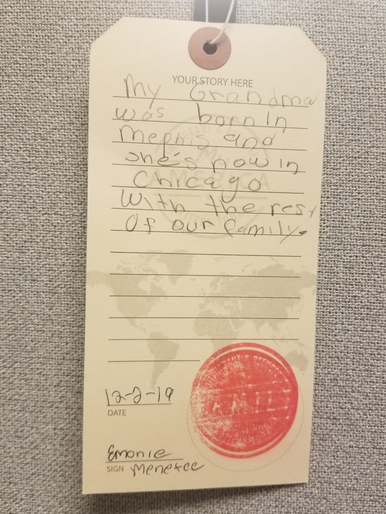 luggage tag sharing a migration story written by a visitor to the My America: Immigrant and Refugee Writers Today exhibit at the American Writers Museum in Chicago