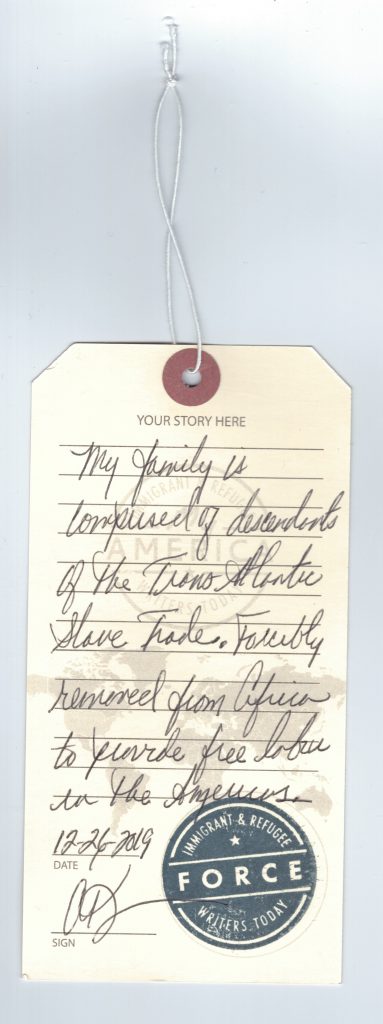 A luggage tag detailing a story written by a visitor to the My America: Immigrant and Refugee Writers Today Exhibit at the American Writers Museum in Chicago