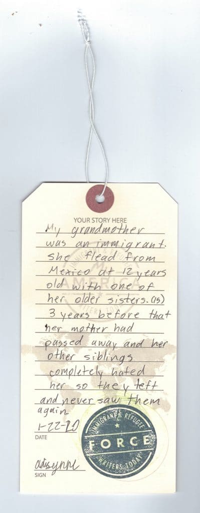 A luggage tag detailing a story written by a visitor to the My America: Immigrant and Refugee Writers Today Exhibit at the American Writers Museum in Chicago
