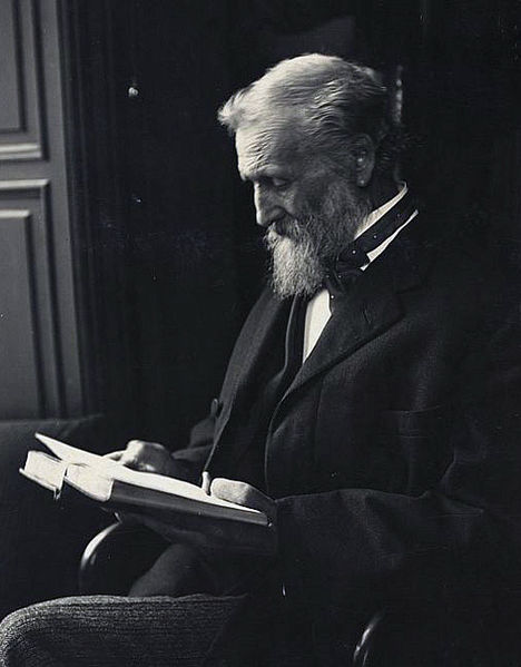 Photo of John Muir reading a book