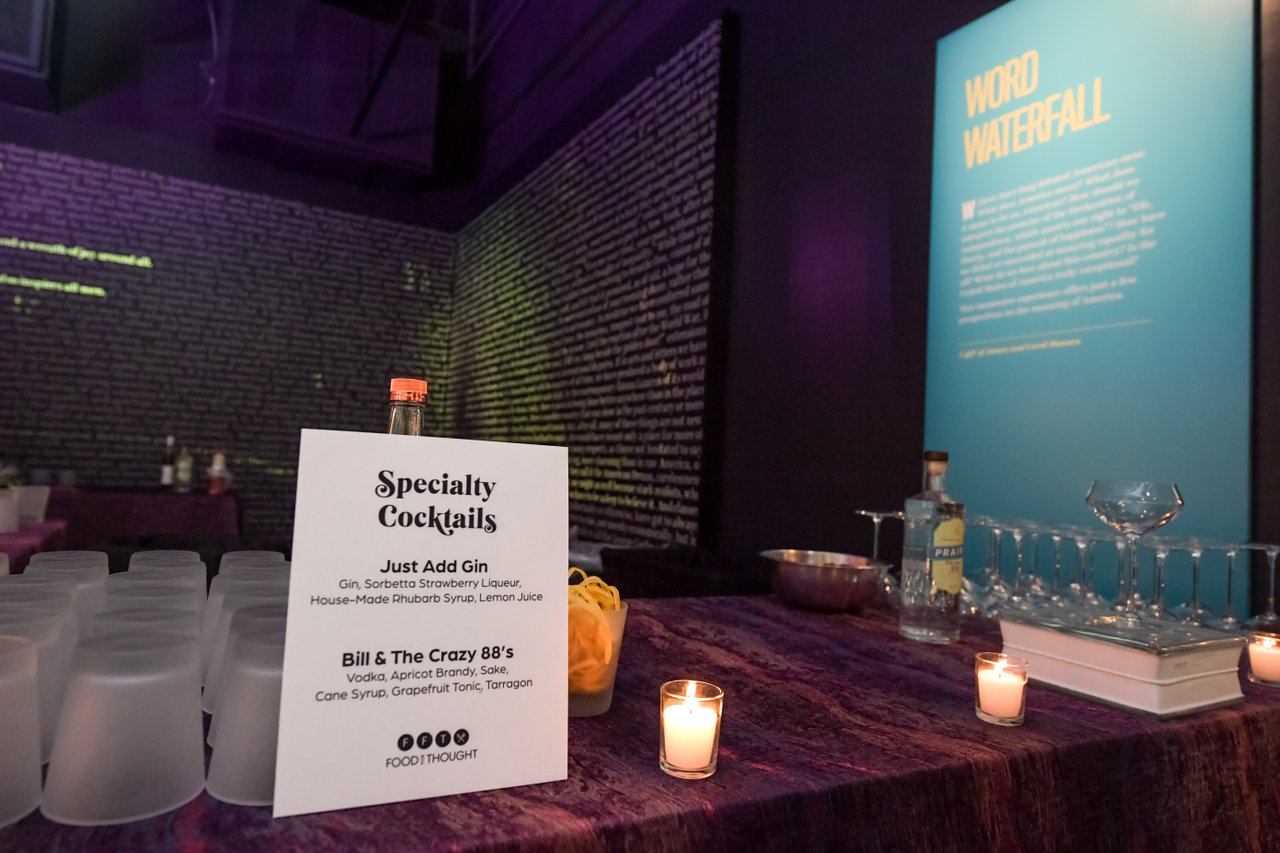 A bar station serving specialty cocktails near the Word Waterfall at the American Writers Museum