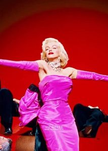 Phot of Marilyn Monroe in a pink dress.