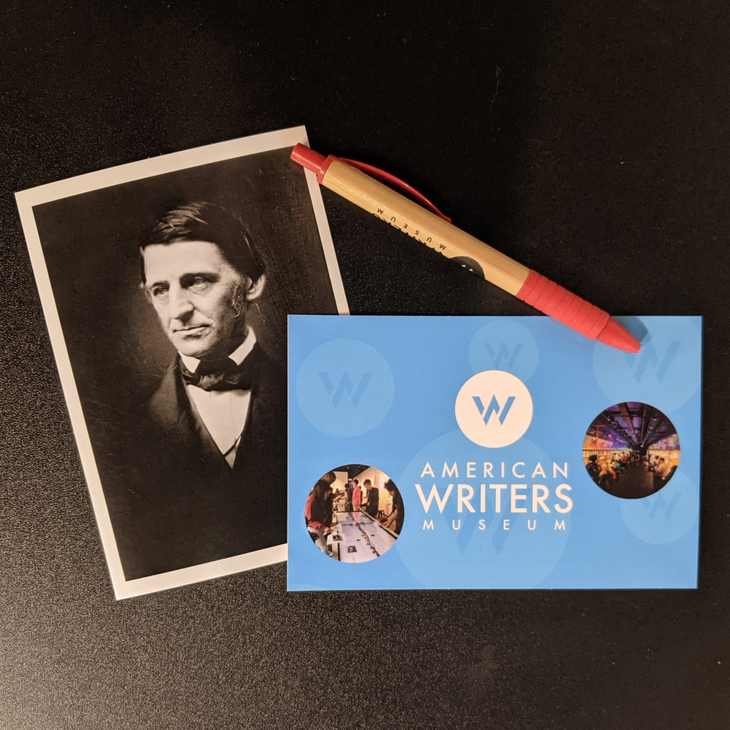 A black and white author postcard, an American Writers Museum postcard, and an American Writers Museum pen